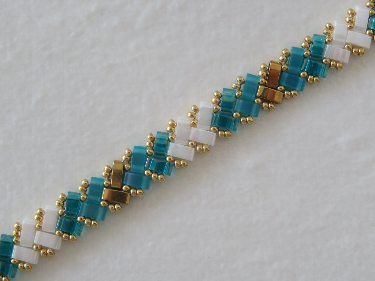 Bracelet 1 rang bicolor sarcelle doré