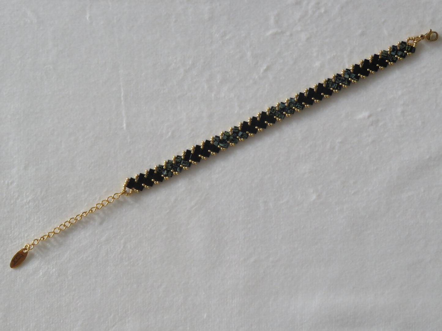 Bracelet 1 rang noir tacheté et brillant