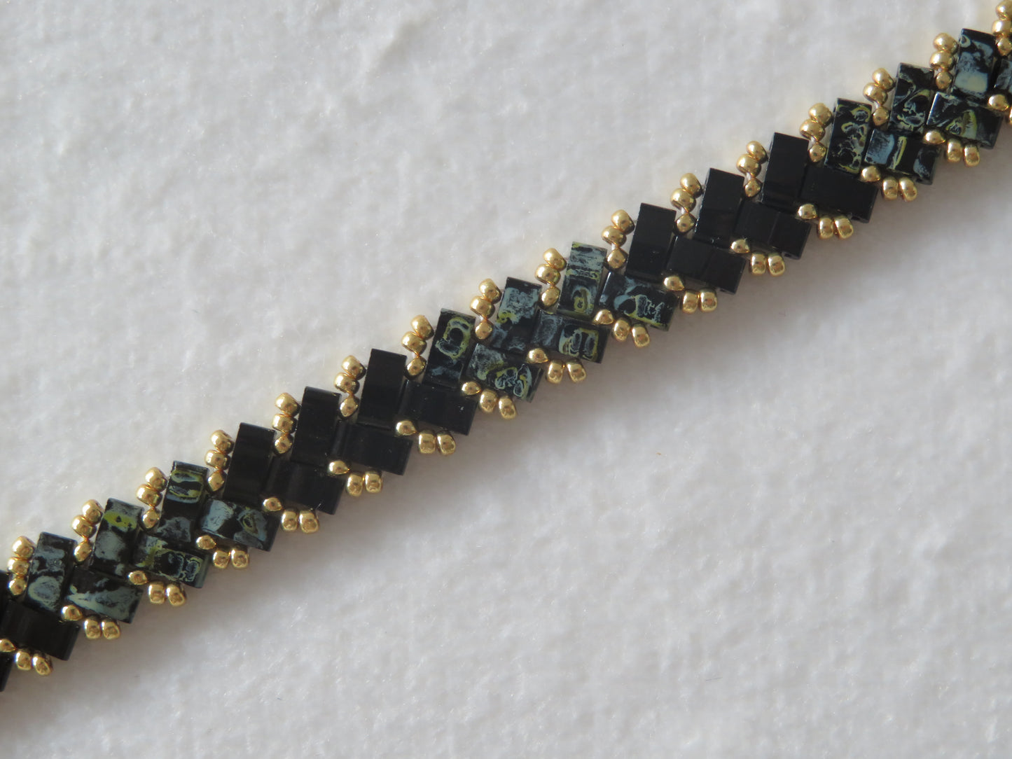 Bracelet 1 rang noir tacheté et brillant