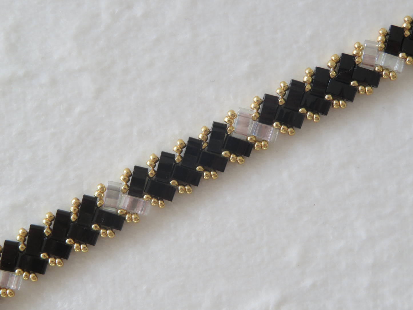 Bracelet 1 rang noir et transparent