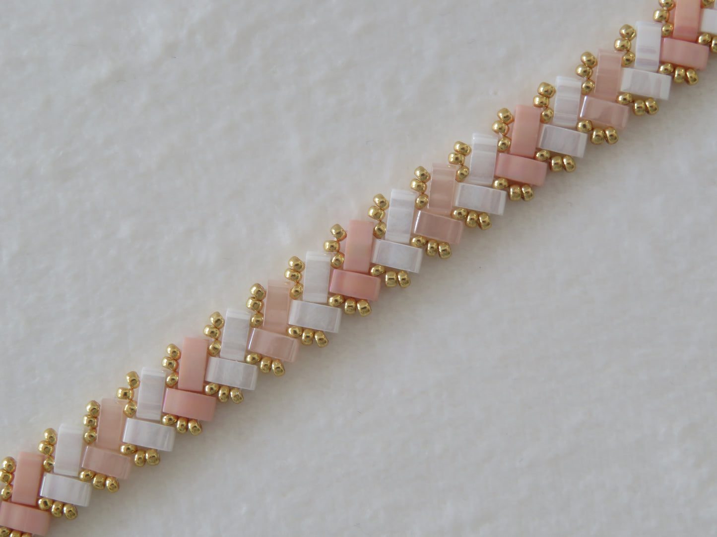 Bracelet 1 rang bicolor rayé rose pale